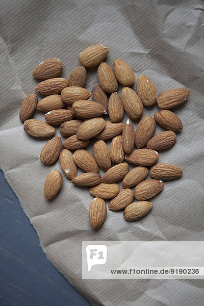 Close-up of almonds on paper