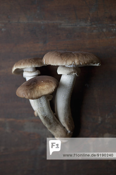Close-up of mushrooms on wooden table