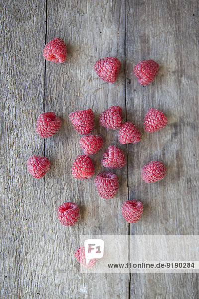 Close-up of raspberries on wooden table
