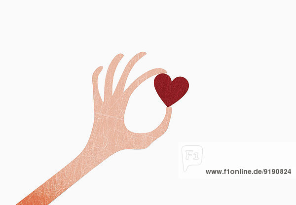 Eine Hand mit Herzform auf weißem Hintergrund