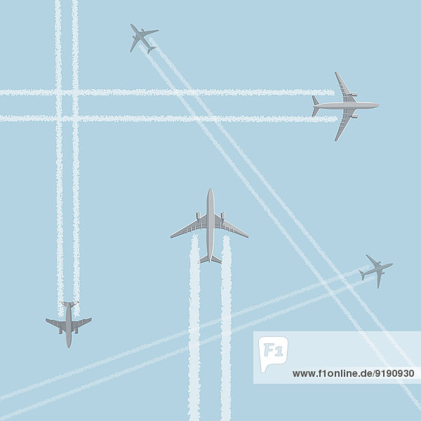 Low-Winkel-Ansicht von Flugzeugen mit kreuz und quer verlaufenden Kondensstreifen gegen klaren Himmel