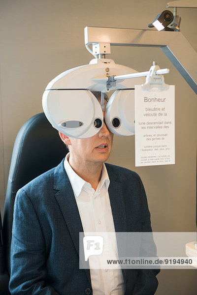 Male patient having eye examination