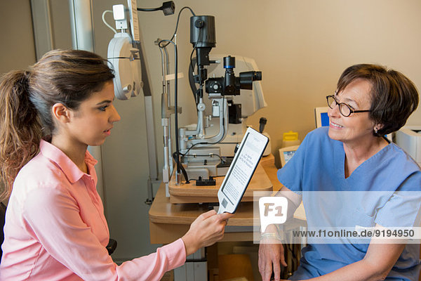 Female patient having eye examination in an optometrist clinic
