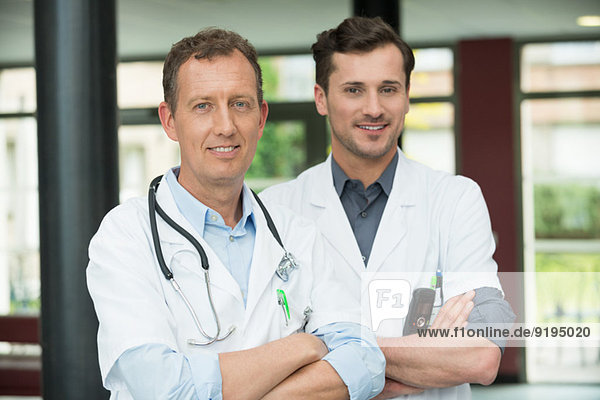 Portrait of two male doctors smiling