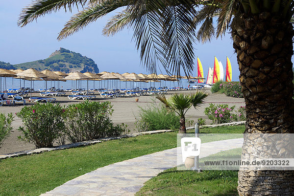 Hotel with view to beach  catamarans and an island  Mediterranean Sea  Southwestern Turkey
