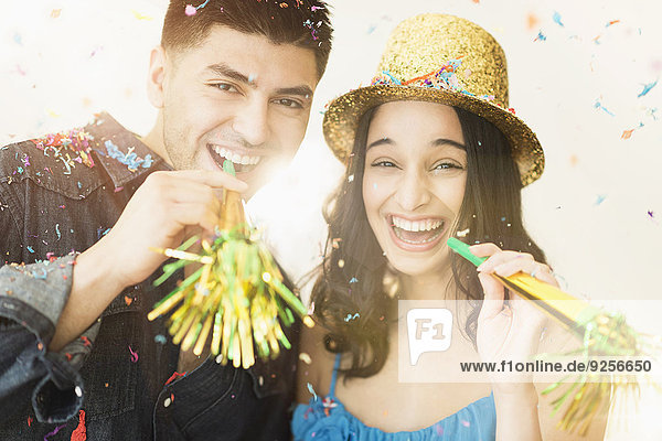 Young couple celebrating New Year's Eve