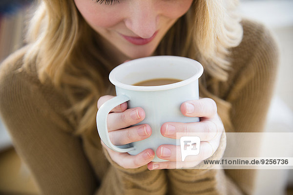 Woman holding coffee mug