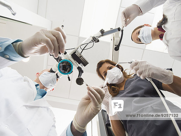 Lowe angle view of dentists and assistant