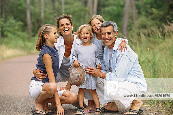 Caucasian family smiling in park