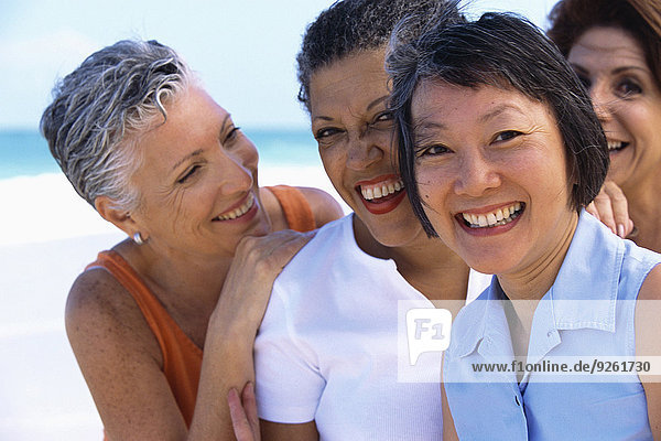 Senior women smiling on beach