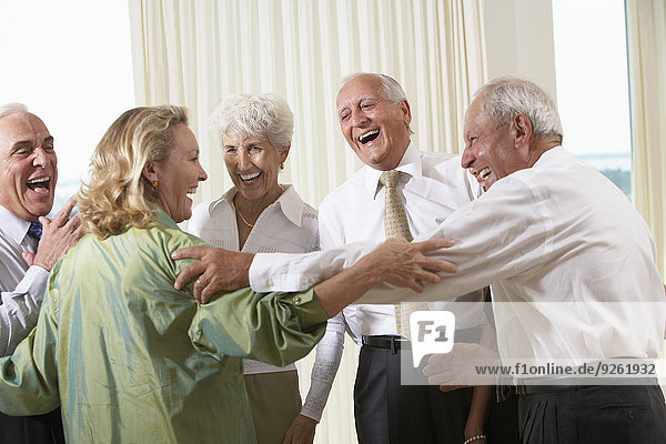 Senior friends laughing together