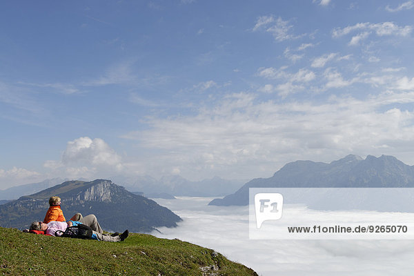 Austria  Tyrol  Chiemgau Alps  Hikers resting at Fellhorn mountain