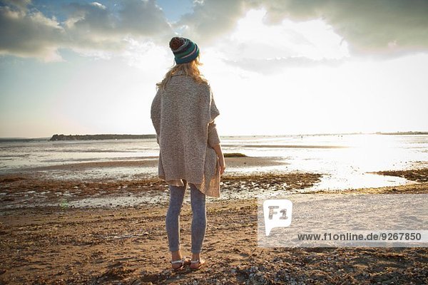 Young woman gazing on Bournemouth beach  Dorset  UK