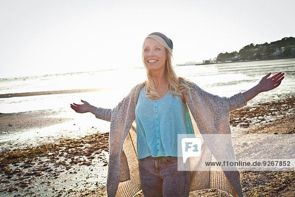 Smiling young woman on Bournemouth beach  Dorset  UK