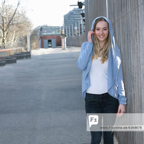 Portrait of young woman wearing hooded top