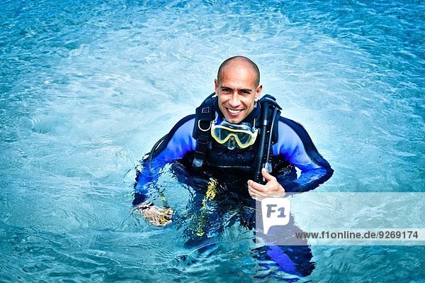 Portrait of mid adult man scuba diving in sea  La Maddalena  Sardinia  Italy