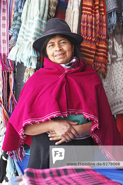 Salasaca Indian woman  47 years  in traditional costume  with hand-woven scarves  Salasaca  Tungurahua Province  Ecuador