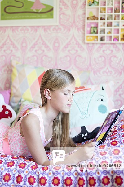 Girl reading in her room