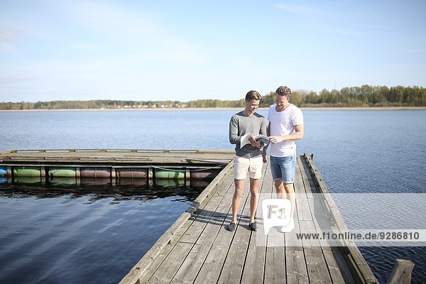 Young men on jetty