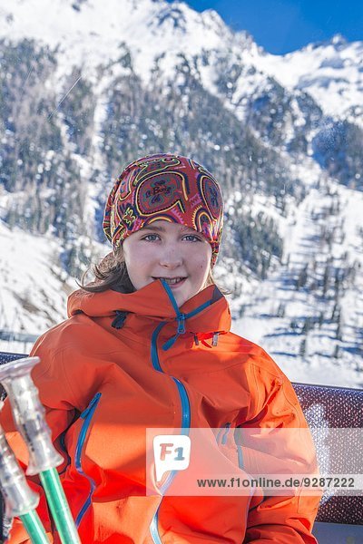 Smiling girl in skiing clothes