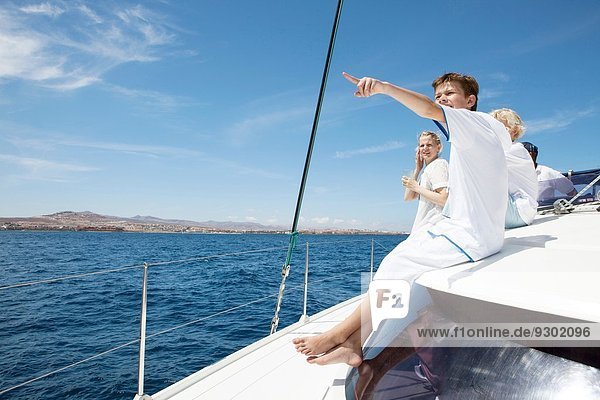 Parents and three sons sailing on catamaran near Fuerteventura  Spain
