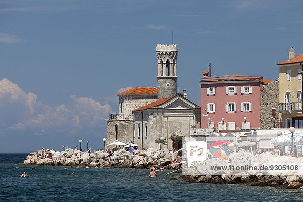 Waterfront with the Church of Our Lady of Health  St. Clement Church  and the lighthouse  Piran  Istria  Slovenia