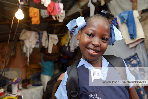 Girl  9 years  in school uniform  Camp Icare for earthquake refugees  Fort National  Port-au-Prince  Haiti