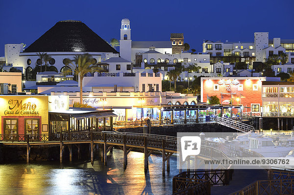 Newly remodeled waterfront at the blue hour  night shot  restaurants  Marina Rubicon  Playa Blanca  Lanzarote  Canary Islands  Spain