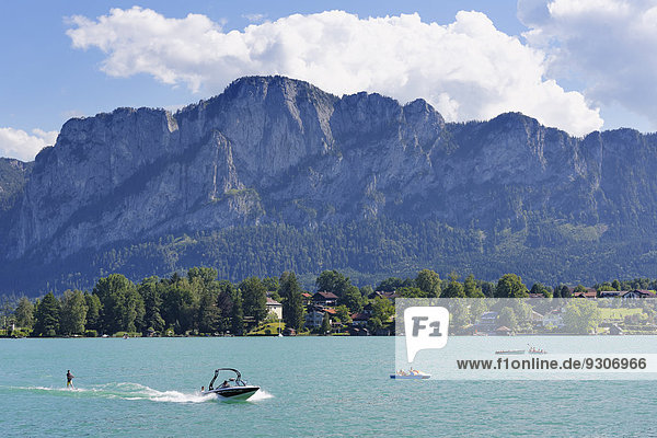Electric boats on Mondsee Lake with Mt Drachenwand  Salzkammergut  Upper Austria  Austria
