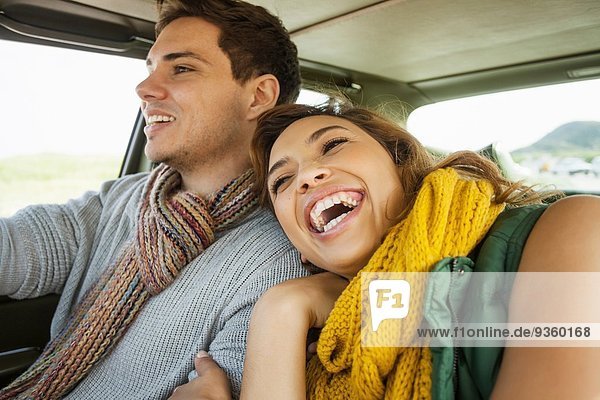 Young couple laughing whilst driving  Cape Town  Western Cape  South Africa