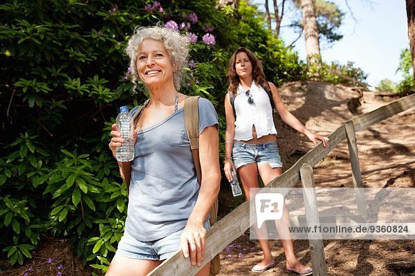 Mother and daughter on footpath  The Blue Pool  Wareham  Dorset  United Kingdom