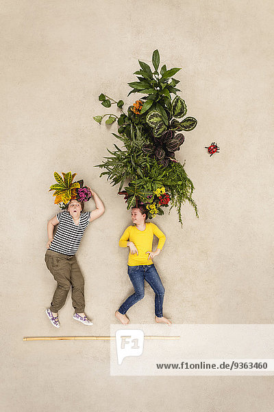 Children with plants growing from their heads