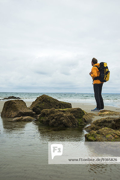 France  Bretagne  Camaret sur Mer  Mature man hiking at Atlanic coast