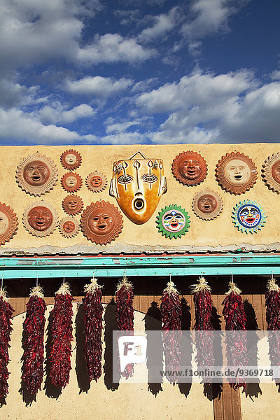 Ornamental masks and hanging dried peppers