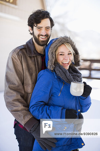 Portrait of happy couple in winter