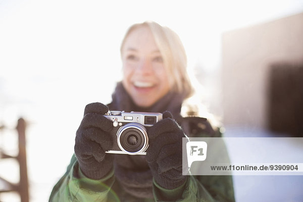 Woman holding old-fashioned camera