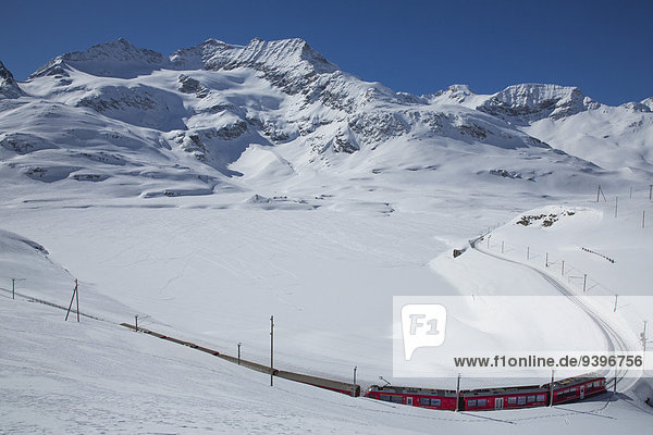 Engadin  Engadine  RHB  Lago Bianco  Bernina Pass  winter  canton  GR  Graubünden  Grisons  Upper Engadine  railway  train  railroad  Rhaetian Railway  Switzerland  Europe
