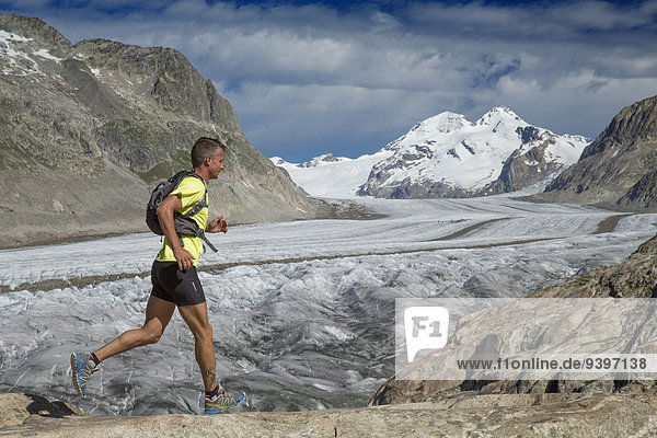 Märijelensee  runner  Aletsch glacier  mountain  mountains  canton  VS  Valais  glacier  ice  moraine  run running  Switzerland  Europe  man