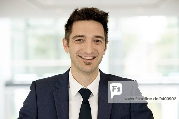 Young business man smiling at camera