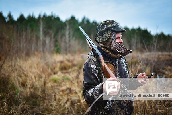 Duck hunter with a cellphone
