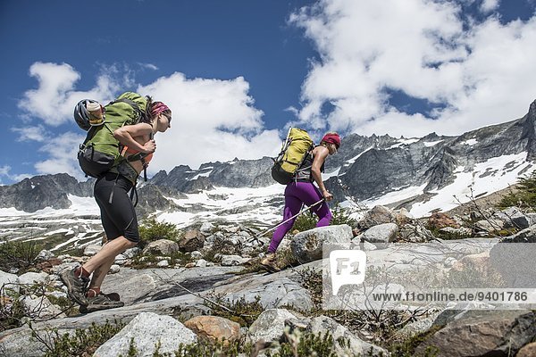 Two women hiking in Boston Basin in North Cascades National Park.