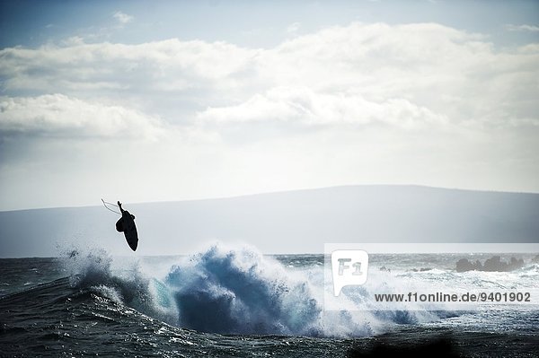 Surfer boosts air in Maui