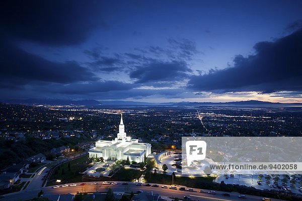 The Mormon (LDS) Temple in Bountiful Utah sits above the Great Salt Lake at dusk.