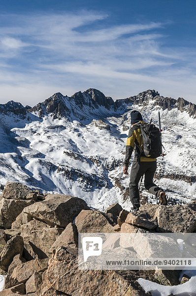 A man hiking along rocky ridge in the La Plata Mountains  Mayday  Colorado.