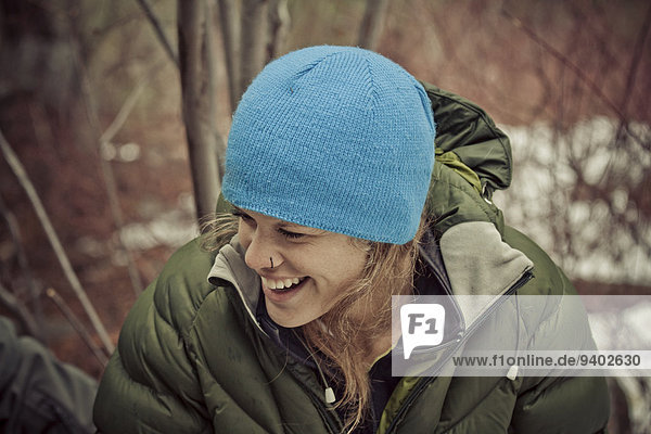 Outdoor portrait of woman laughing.
