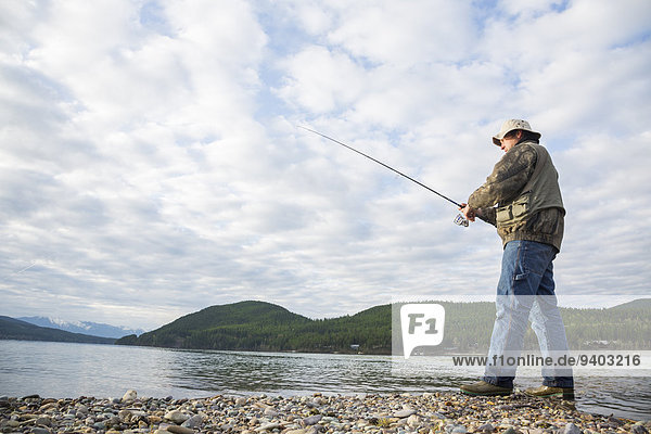 A man fishing on Whitefish Lake in Whitefish  Montana.