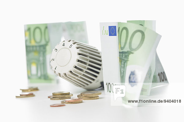 Thermostat  Münzen und 100 Euroscheine