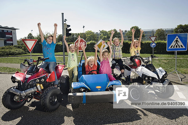 Excited children on driver training area