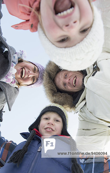 Portrait of family in winter  smiling