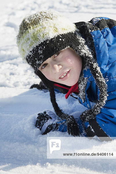 Portrait of boy in snow  smiling